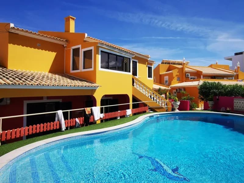 Noma Village coliving exterior with swimming pool in Lagos Portugal Algarve