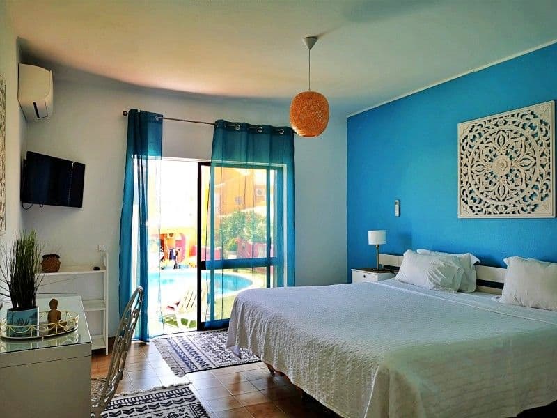 Private ensuite room with dedicated workspace desk for remote work at Noma Village Lagos