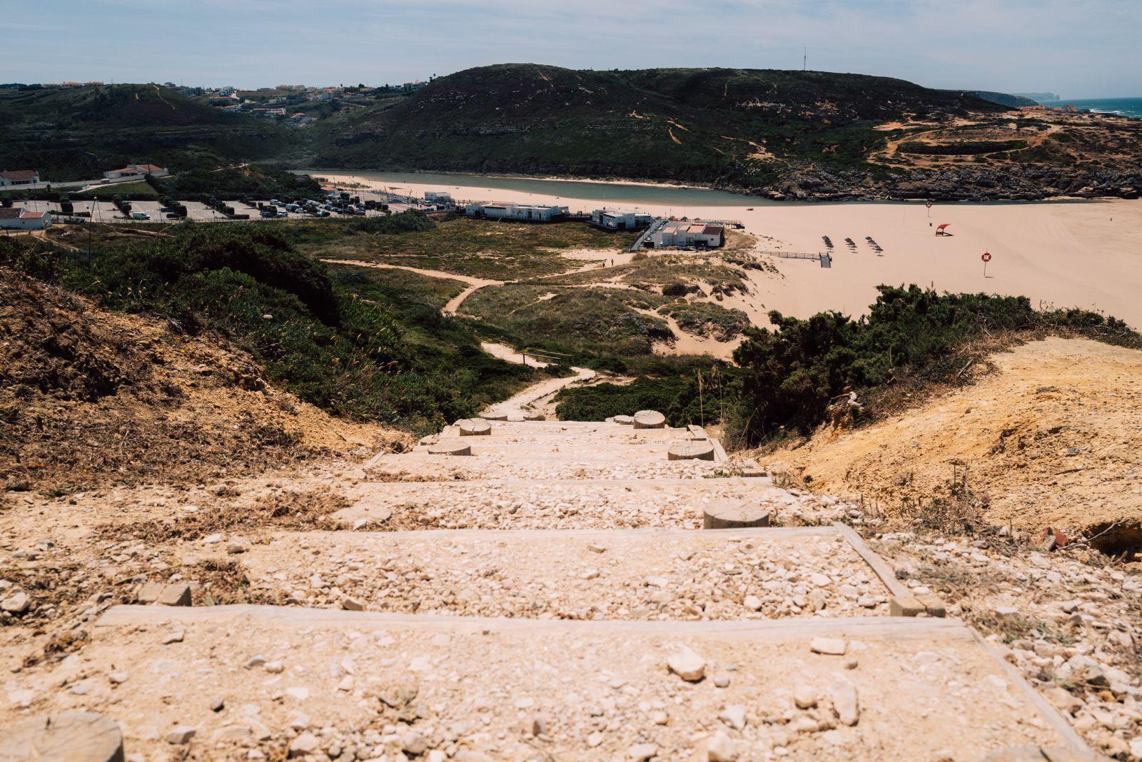 Stone steps leading down to Foz do Lizandro beach near Ericeira