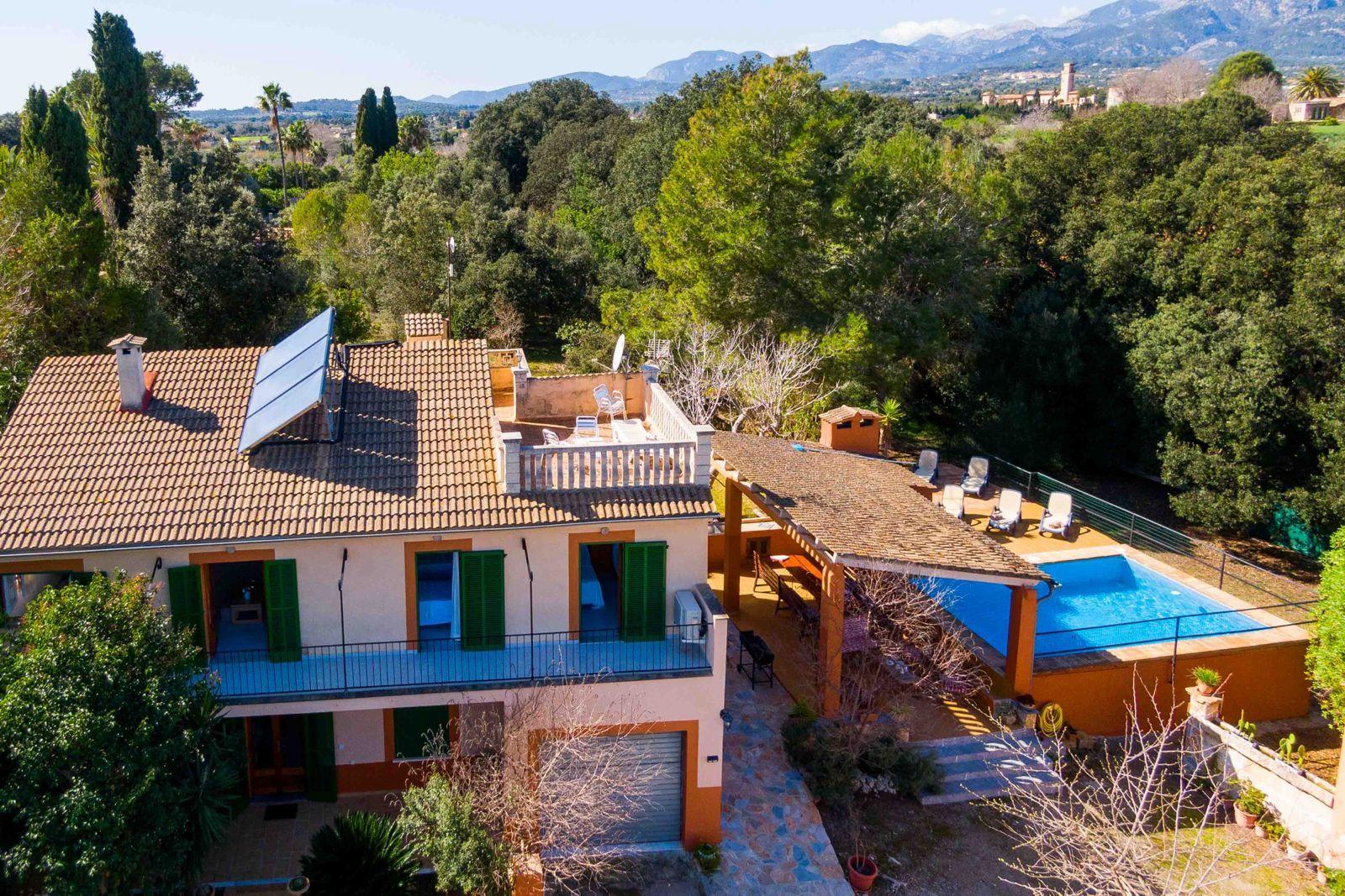 Aerial view of the Nomadico coliving home in Mallorca with pool and mountain views