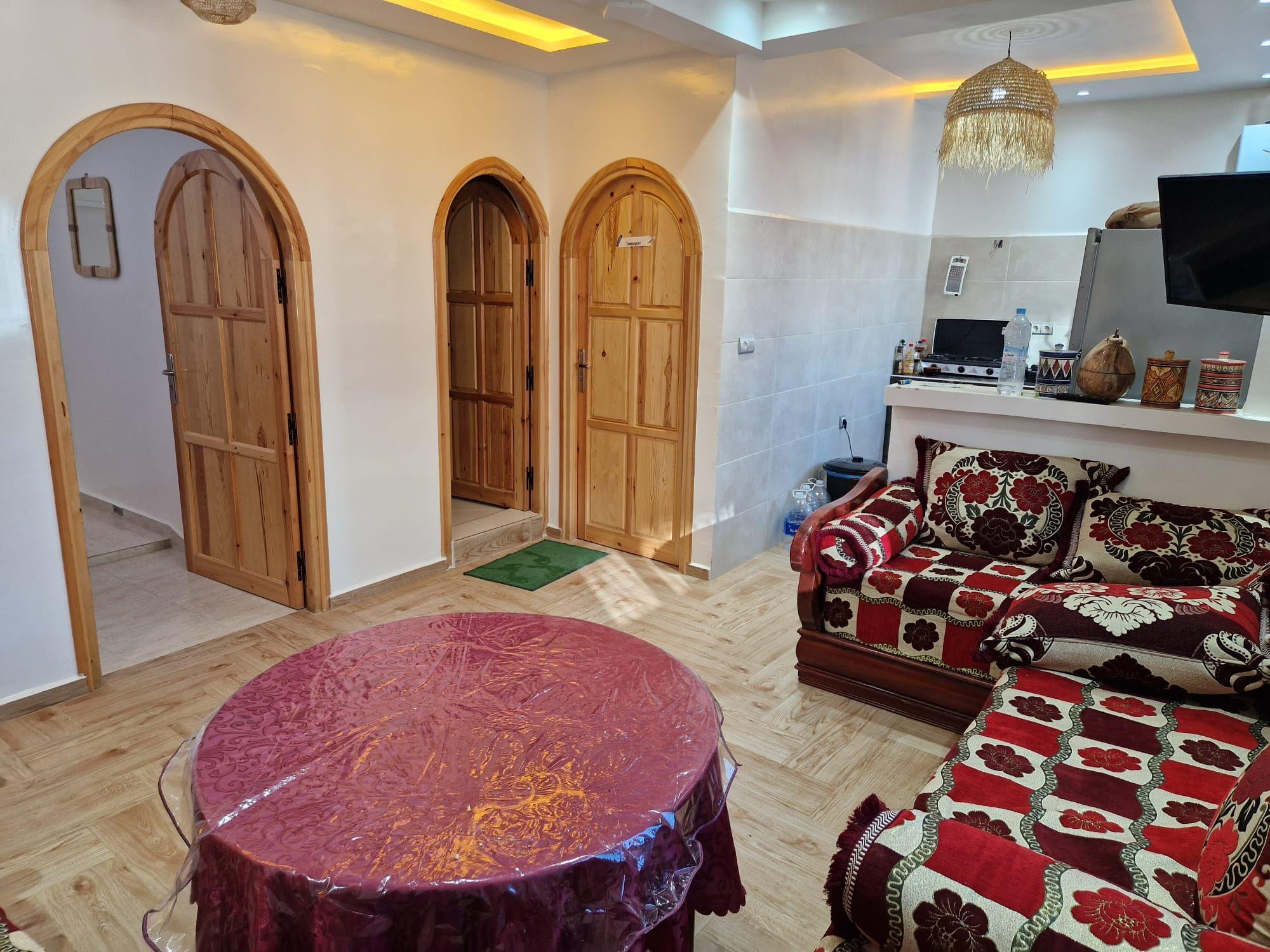 Interior lounge area at Abdel Sin with traditional Moroccan arched doors and colorful seating