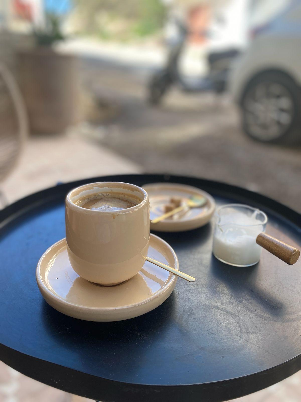 Specialty coffee served in a ceramic cup at a local café in Tamraght