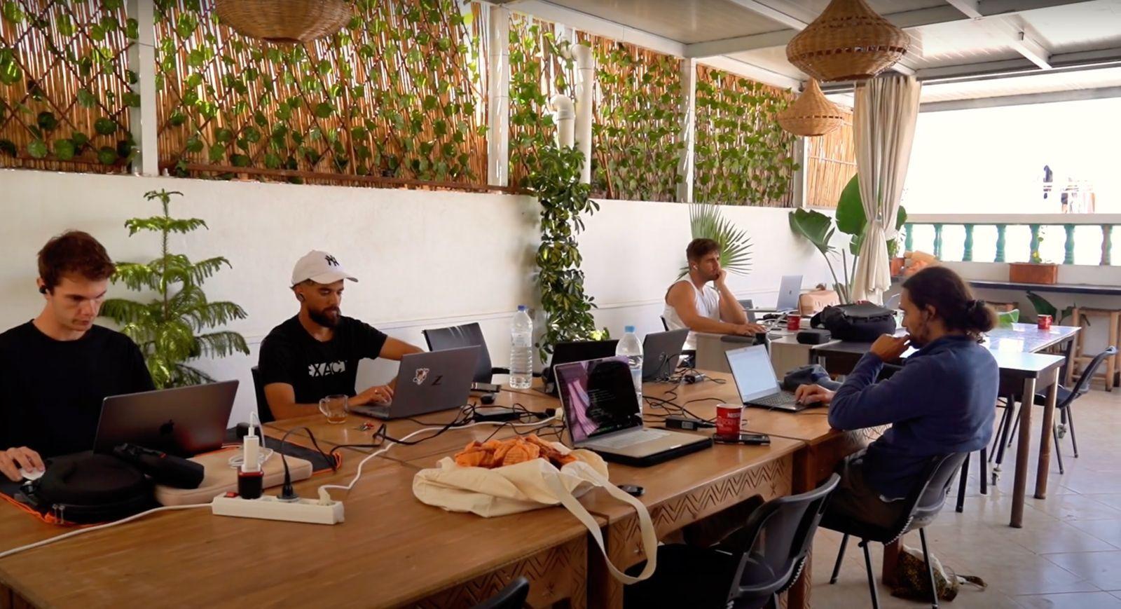 Wide view of the rooftop coworking space at Abdel Yan with people working