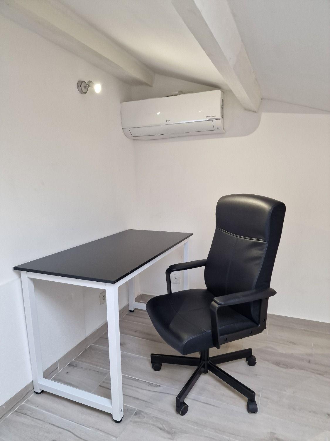 Room Paris attic showing the workspace area with desk and office chair