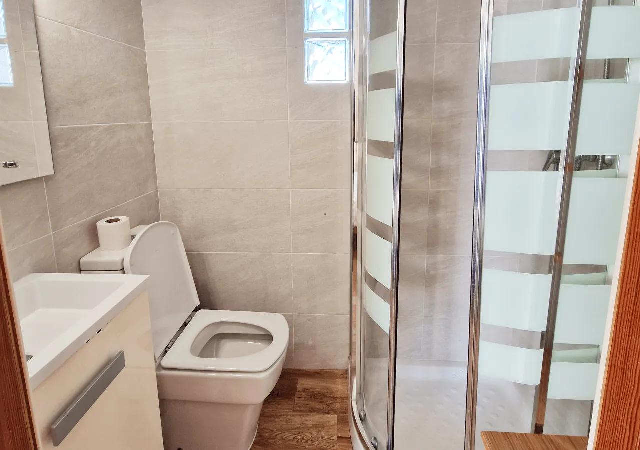 Private bathroom of the Laguna ensuite bedroom with shower and toilet