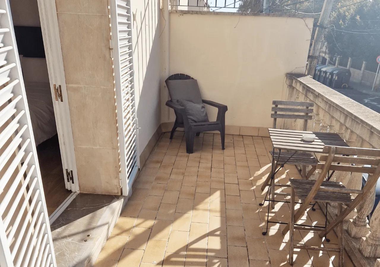 Private balcony of the Laguna ensuite bedroom with outdoor chair and small table