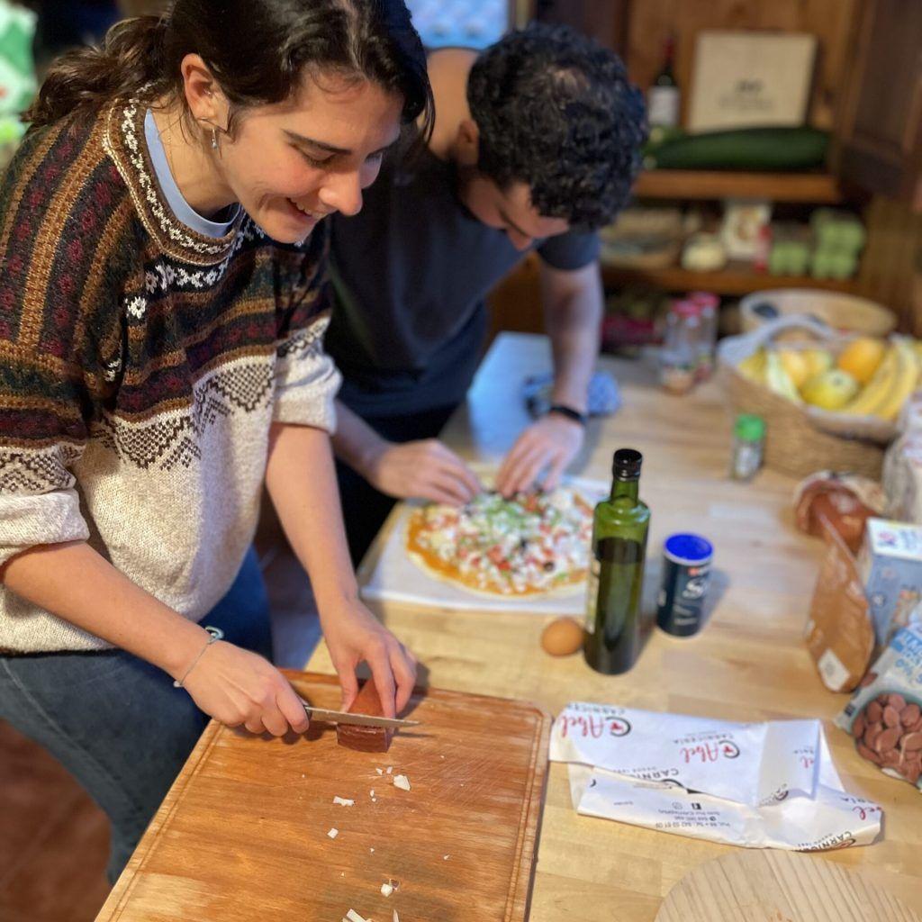 Community cooking together with fresh ingredients from the garden