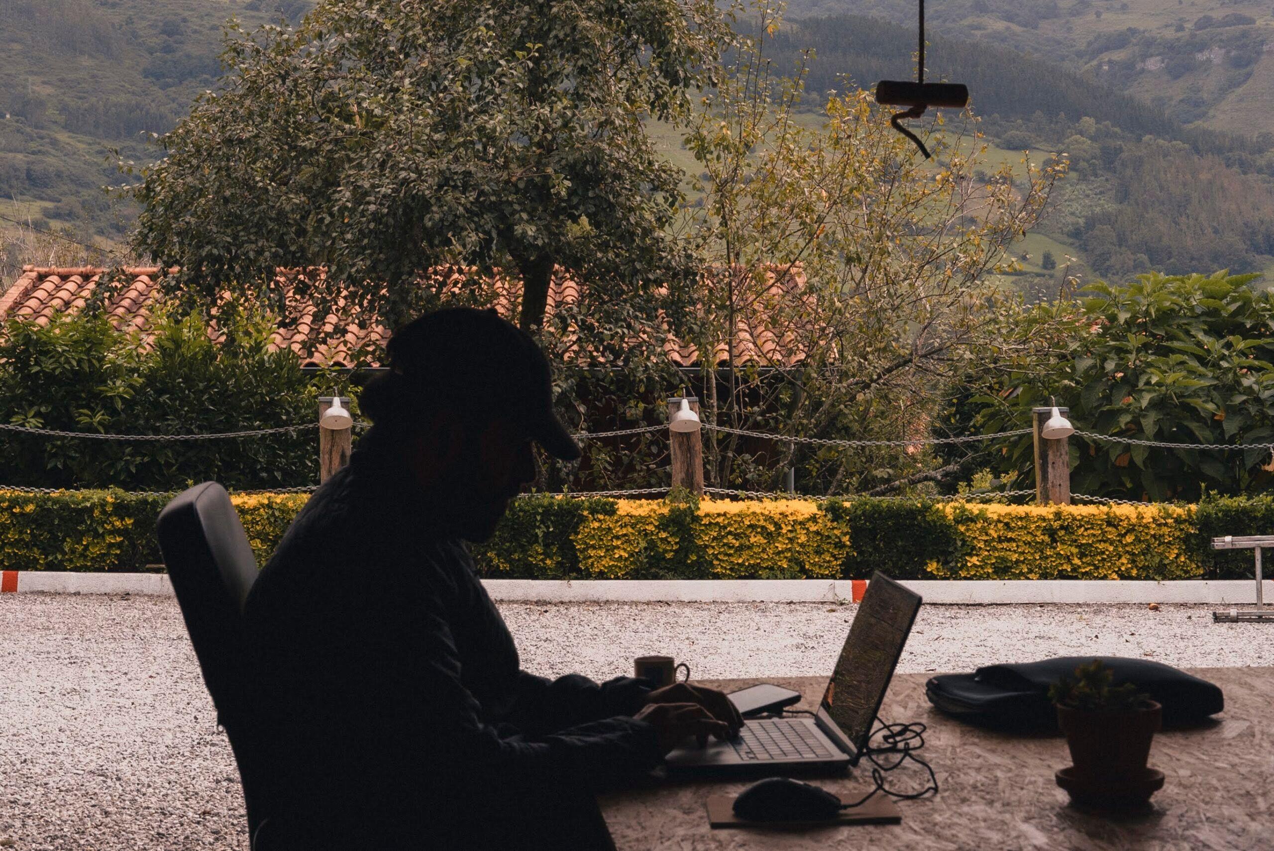 Rural coliving property with wooden cabins in the mountains
