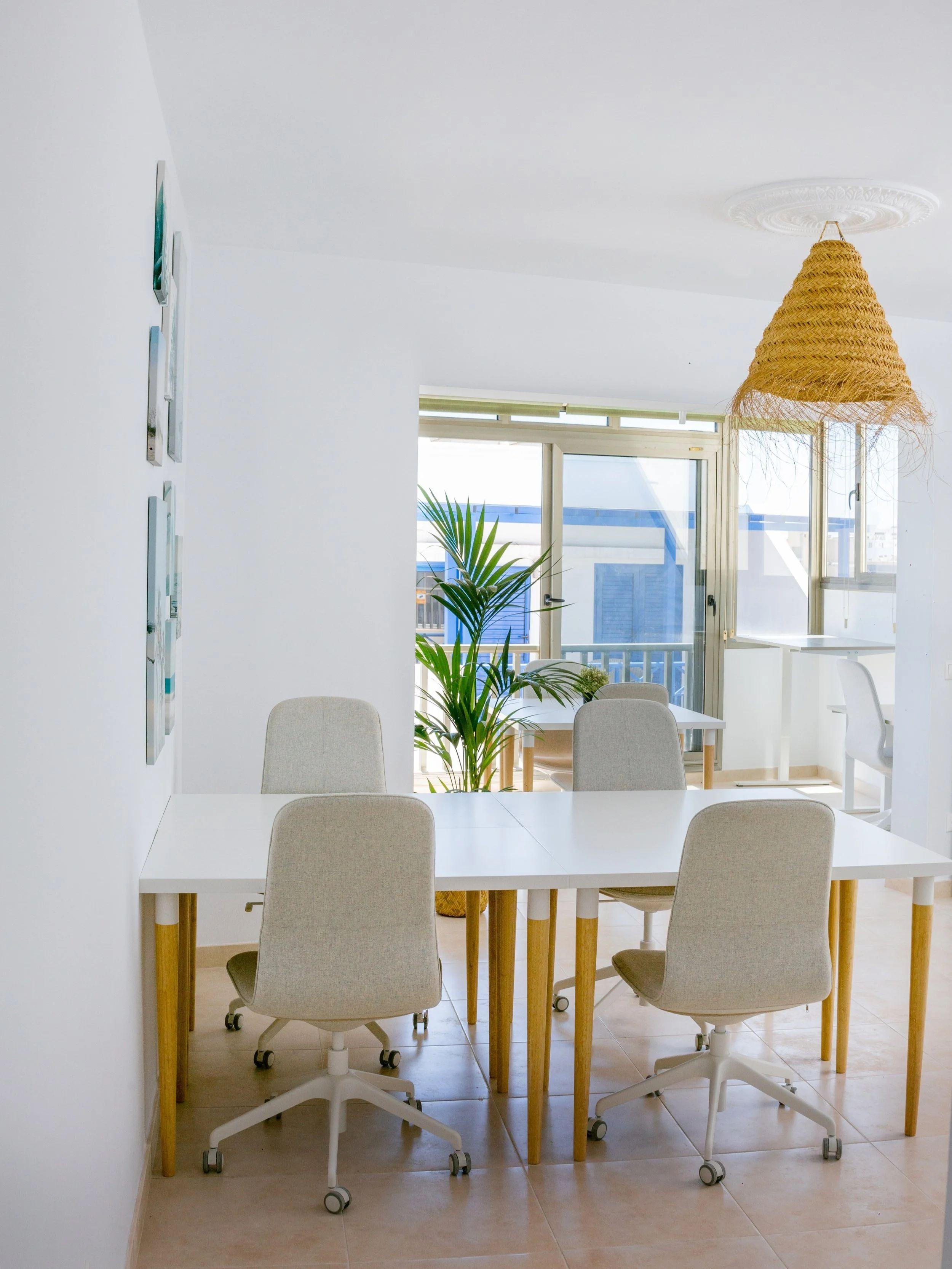 Professionally equipped coworking space at Pitaya Coliving with high-speed internet, ergonomic chairs, standing desks and monitors