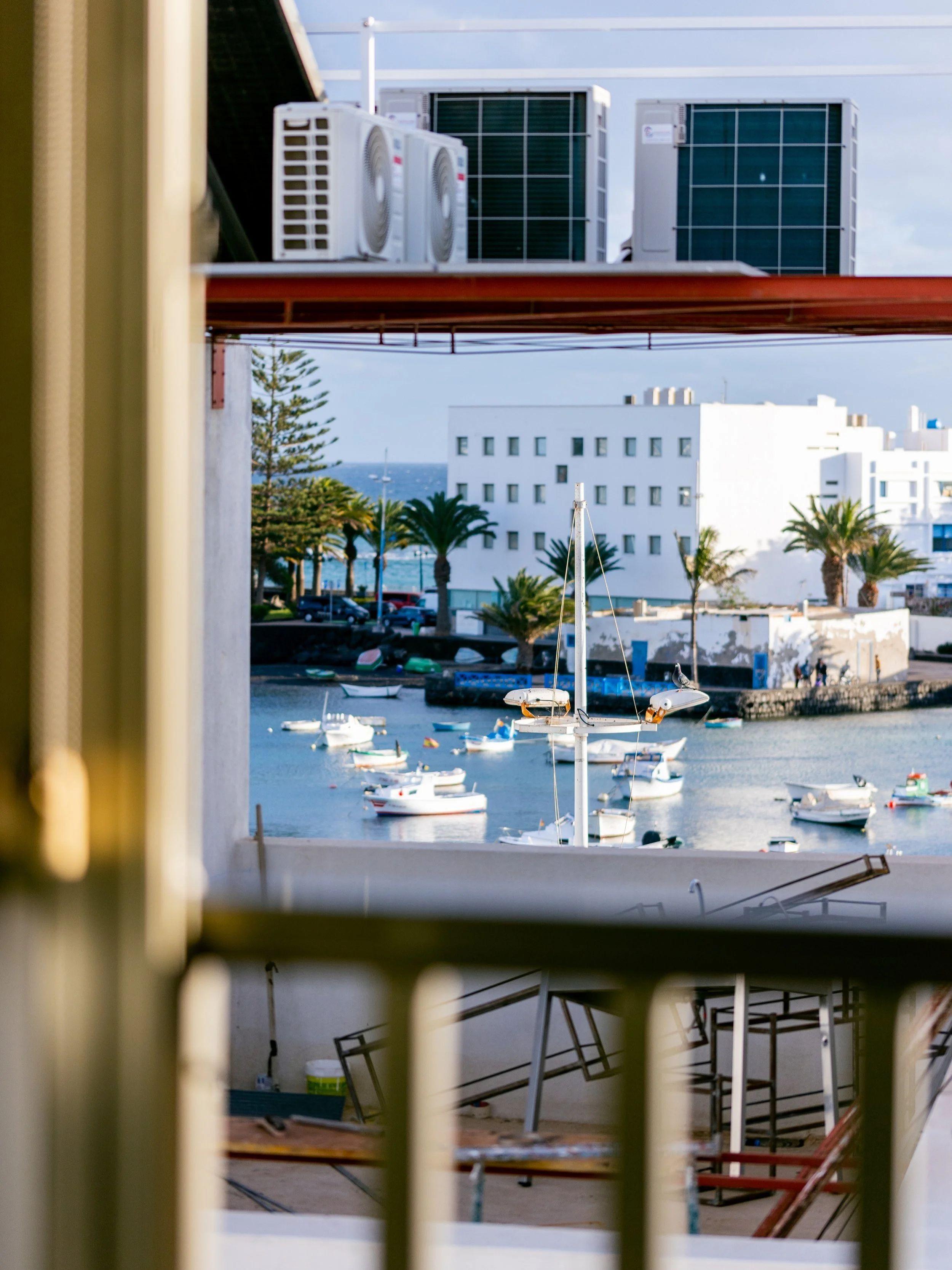 Coworking area at Pitaya Coliving with view over the sea, lagoon and old town