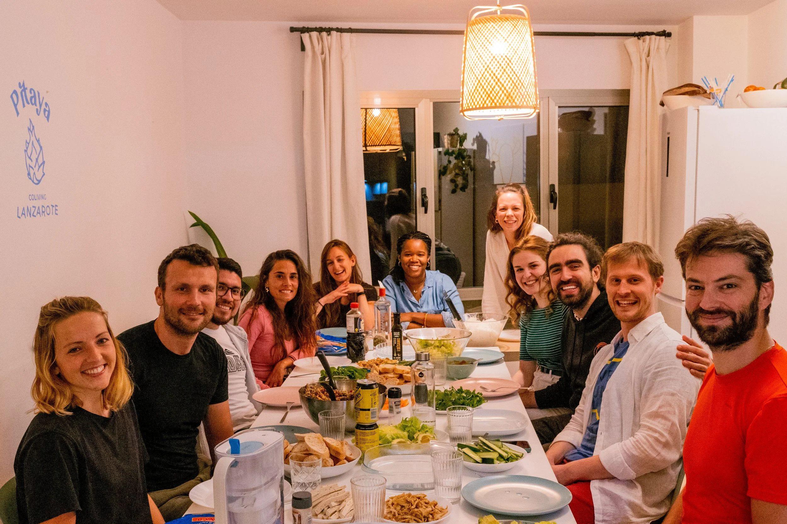 Community family dinner at the Pitaya Coliving dining table with residents gathered together