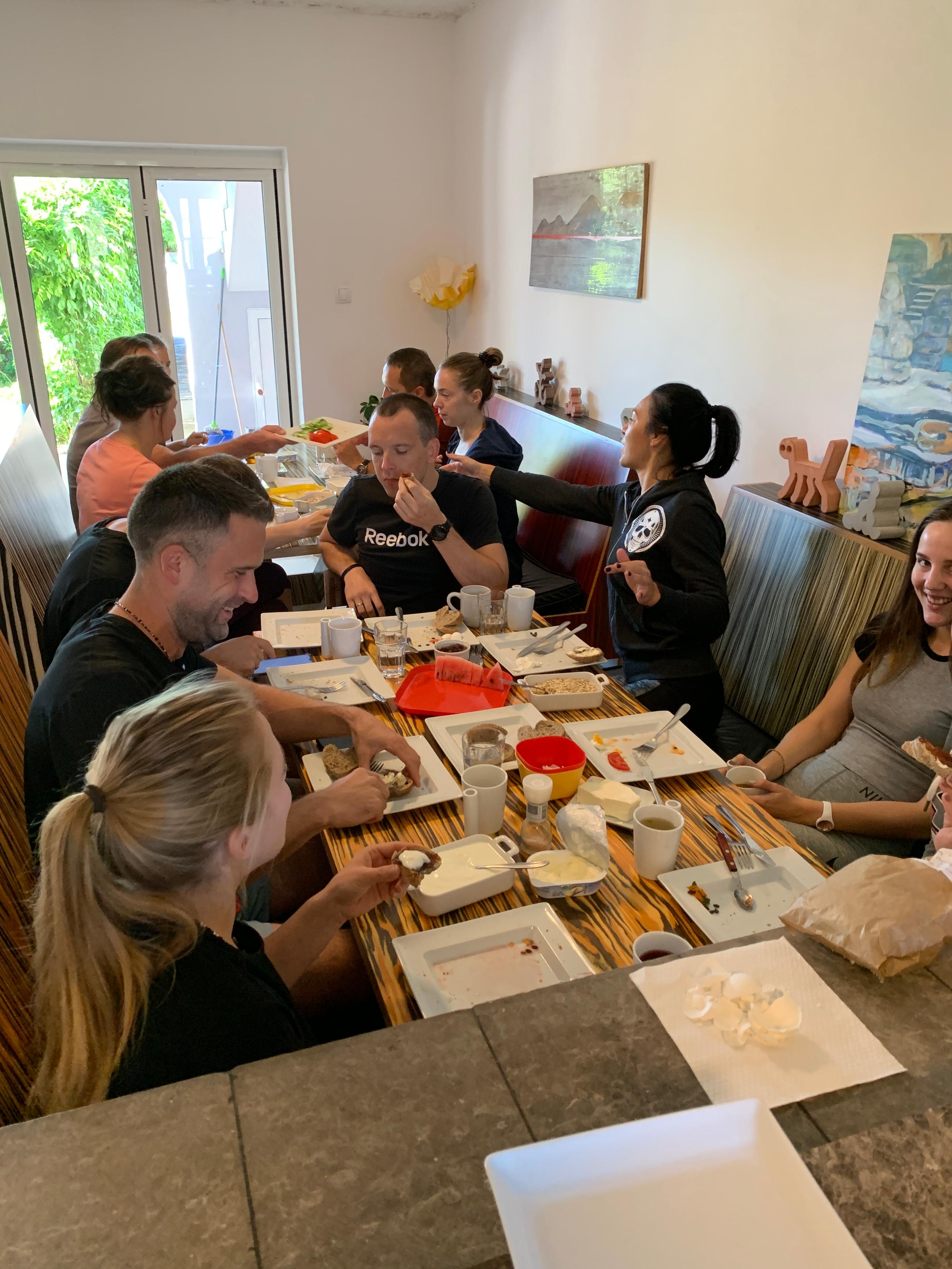 Large group of residents sharing a meal together at the dining table