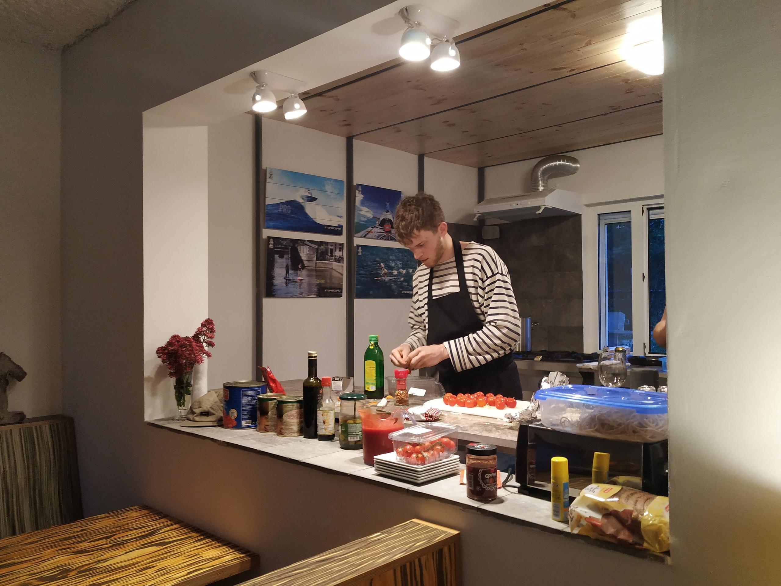 A resident preparing food at the kitchen counter