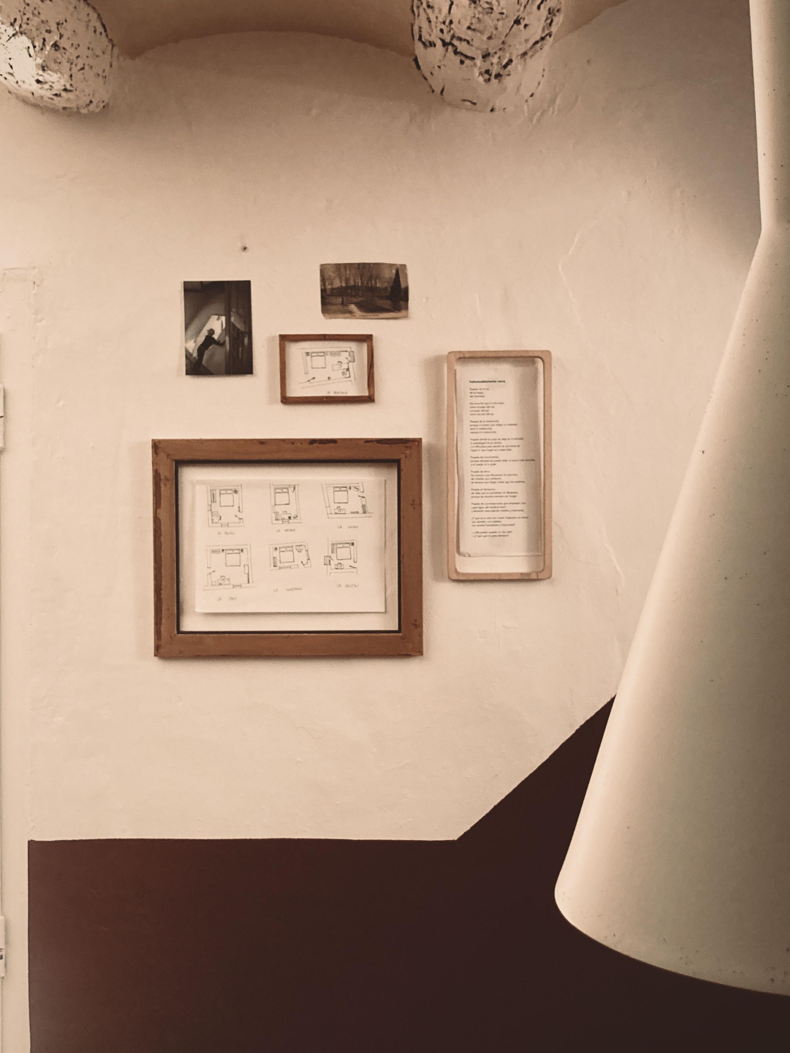 Several picture frames on the staircase leading up to La Rinko room at Posada de la Luz