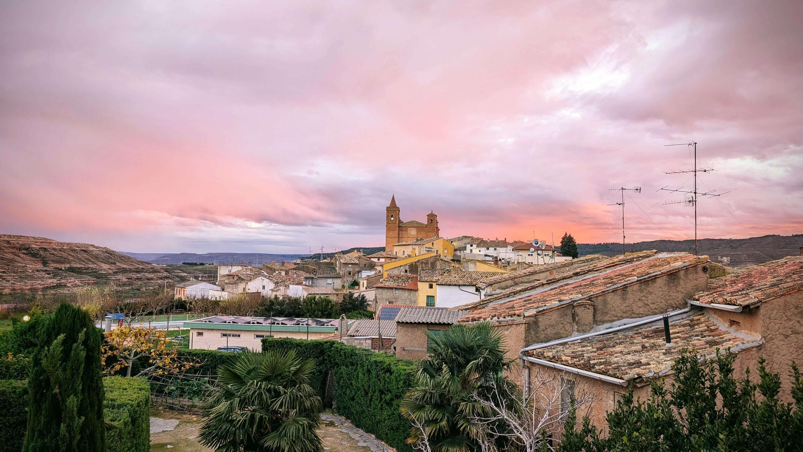 360° rooftop terrace at Posada de la Luz showing the garden, village rooftops and the Church of San Miguel