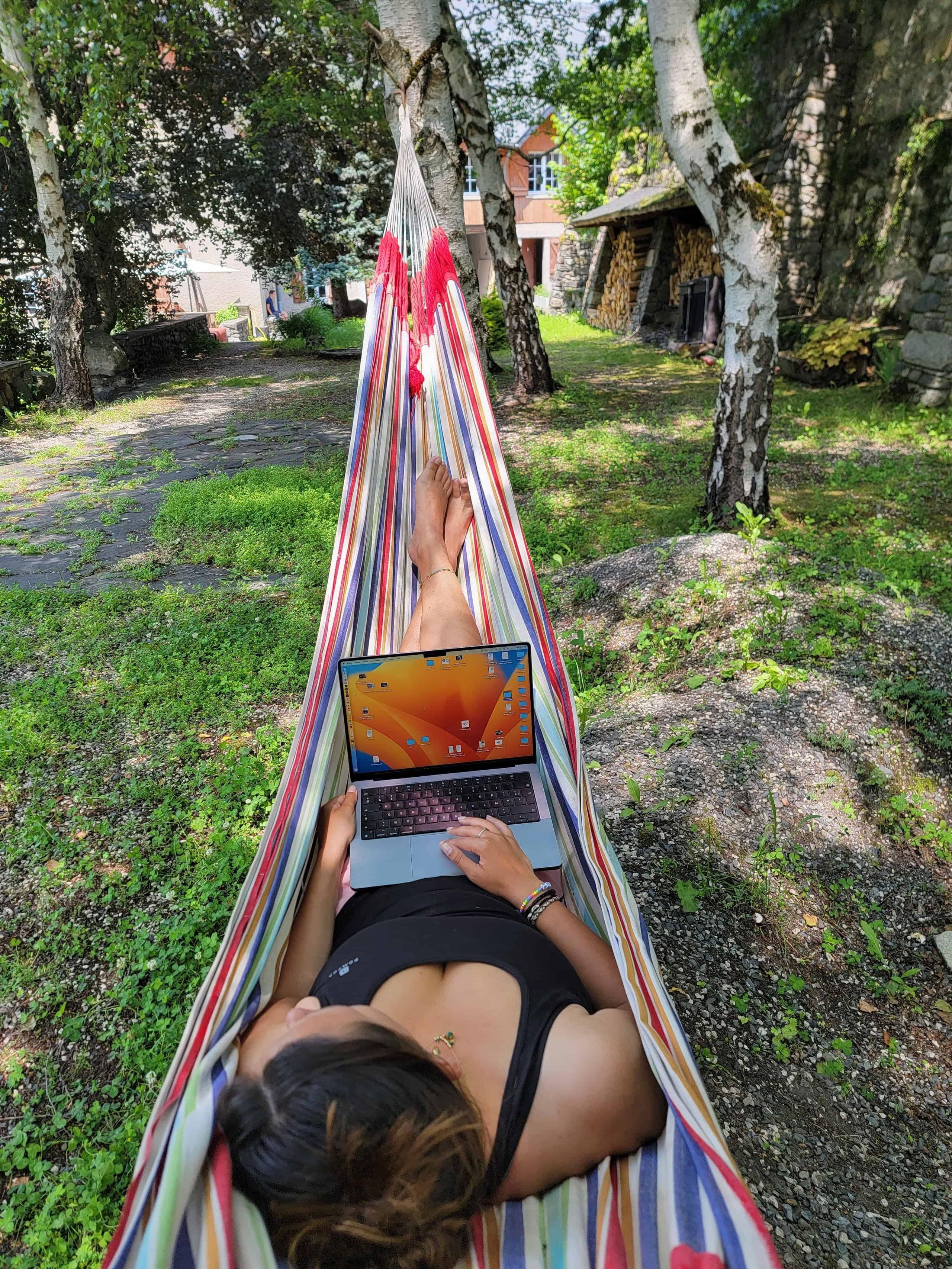 Person working outdoors on the terrace with mountain views