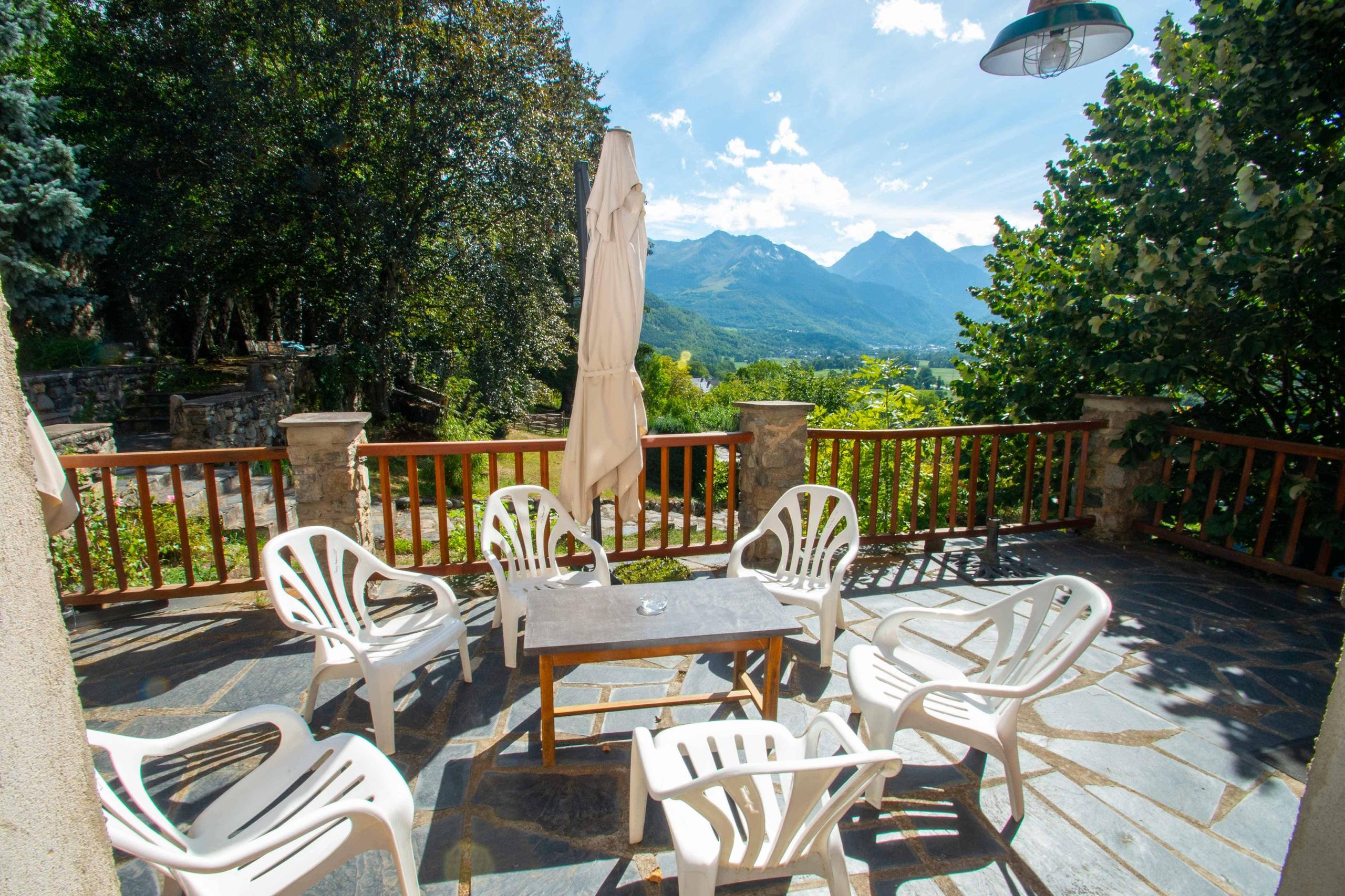 Sunny terrace at Pyren'Escape with panoramic mountain views