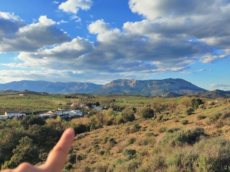 Panoramic view of the Andalusian village and Sierra María-Los Vélez mountains under a dramatic cloudy sky