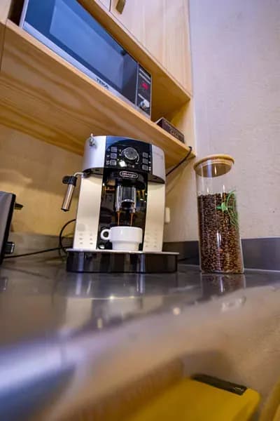 Coffee machine and kitchen equipment on countertop