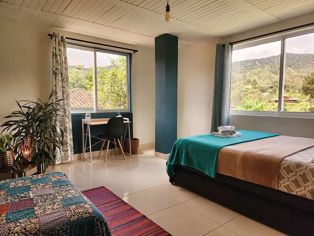 Premium private room with double bed at the Guatapé coliving location