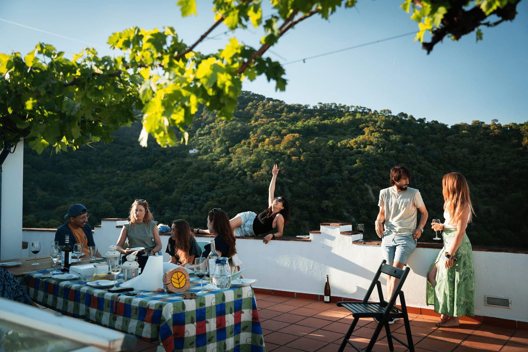Digital nomads and remote workers from Rooral coliving hanging out on rooftop, enjoying community and views