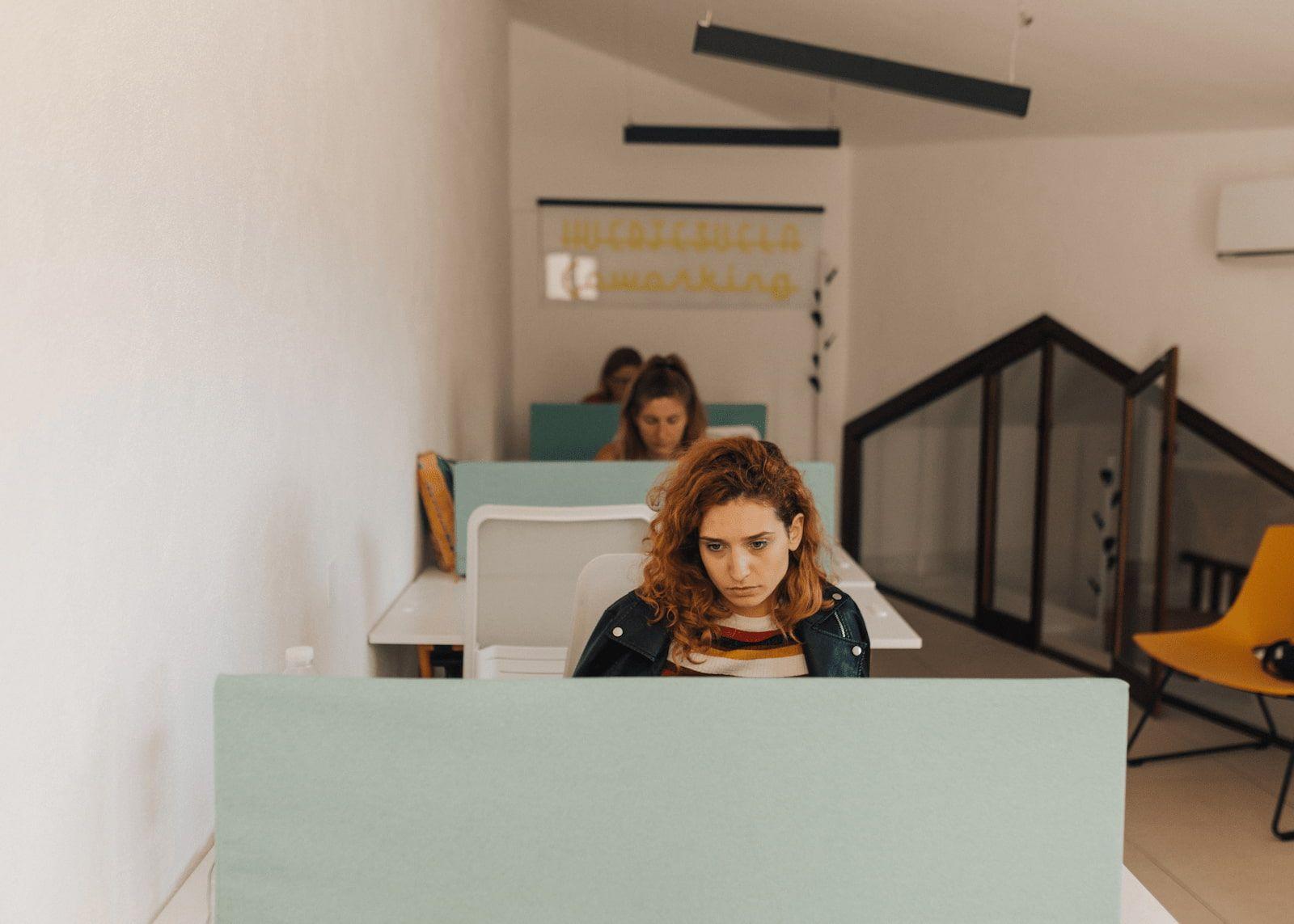 Coworker focusing on work indoors at Rooral rural coworking and coliving space in Spain