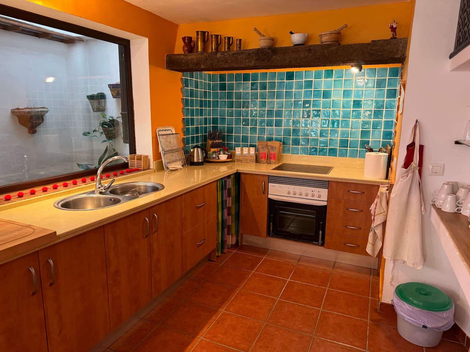 Bright and spacious kitchen in Rooral coliving home near Malaga, Spain, designed for digital nomads and remote workers