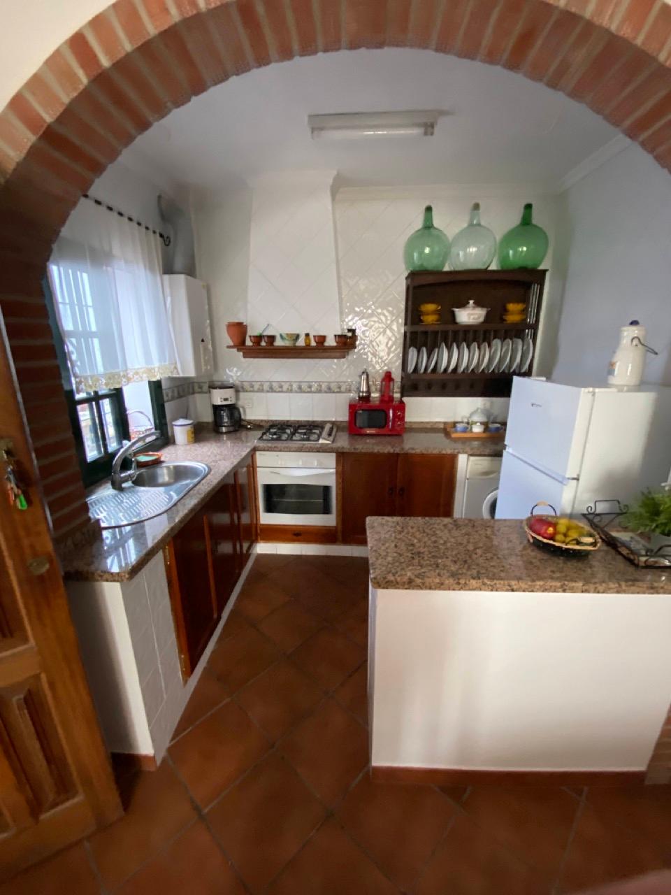 One of the fully equipped kitchens at our rural coliving space in Benarraba, Malaga, ready to inspire your favorite dishes