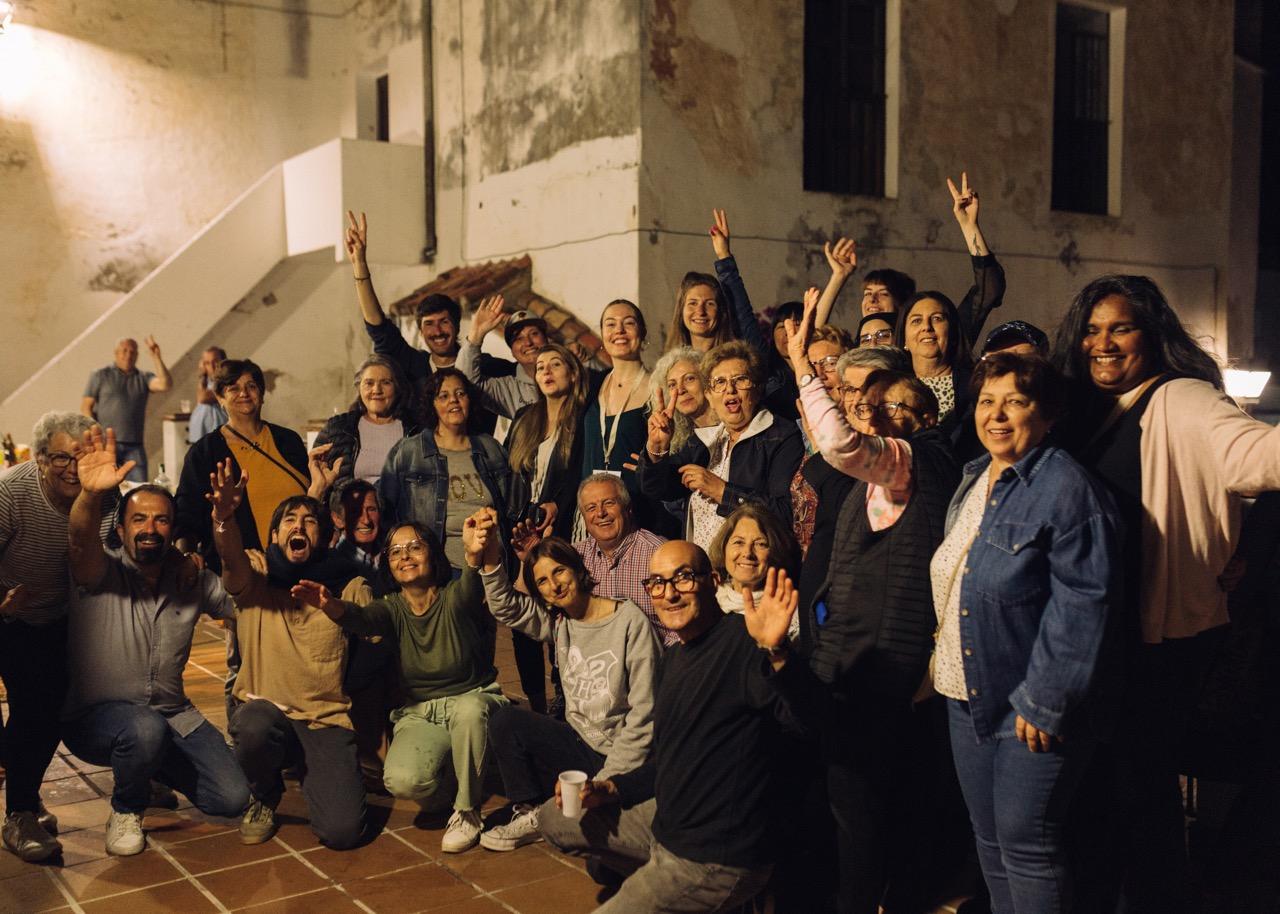 Remote workers and local community of Benarraba Malaga saying hello to the camera, representing the urban rural connection