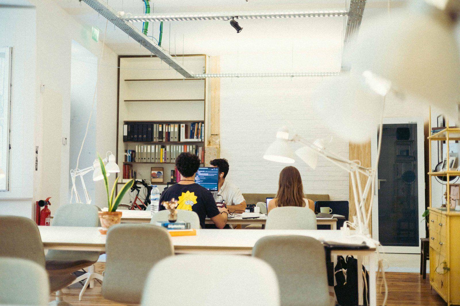 Overview of the BECO coworking space with multiple work tables