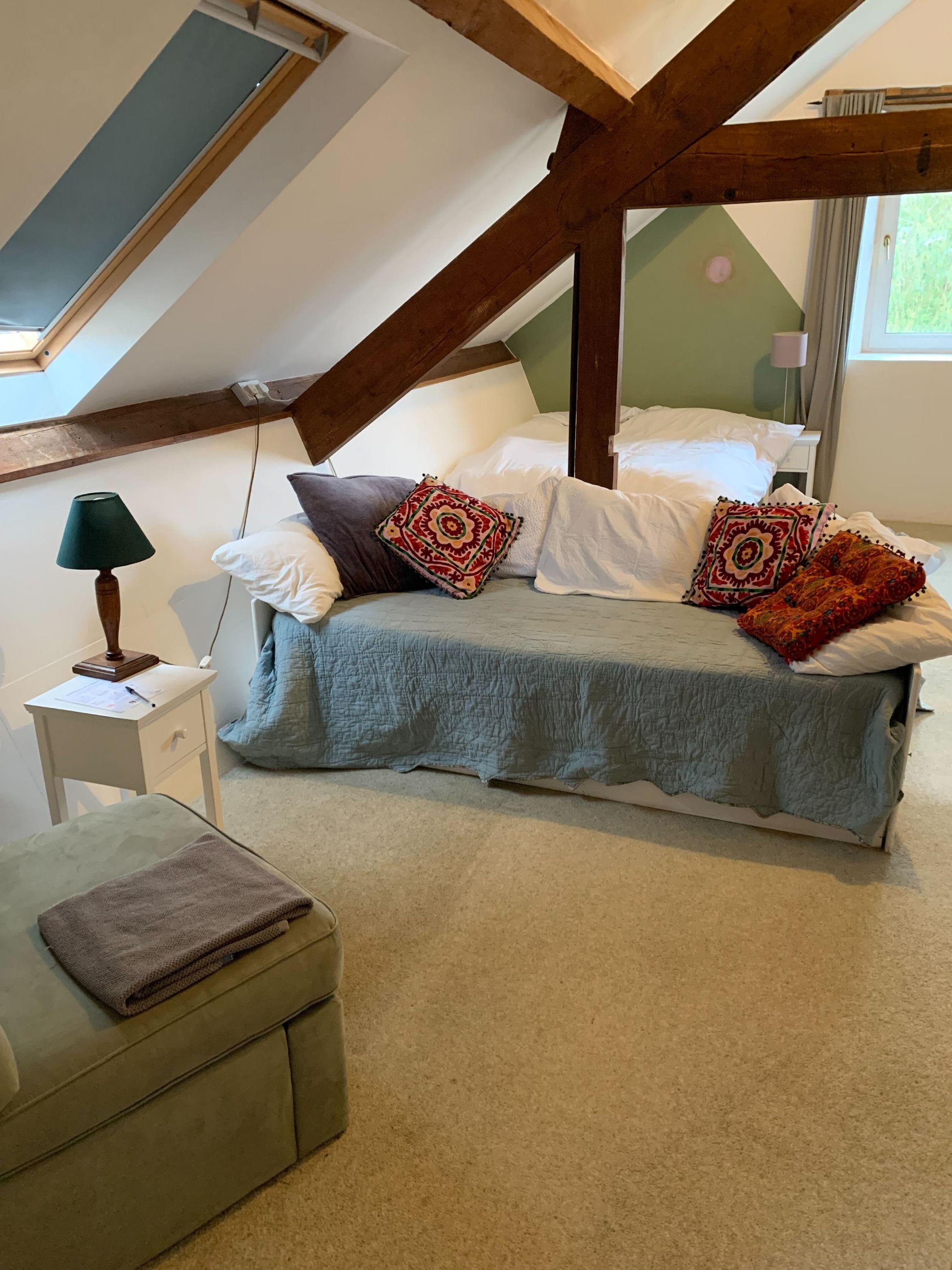 Large ensuite room on the top floor with skylights, exposed beams and double bed