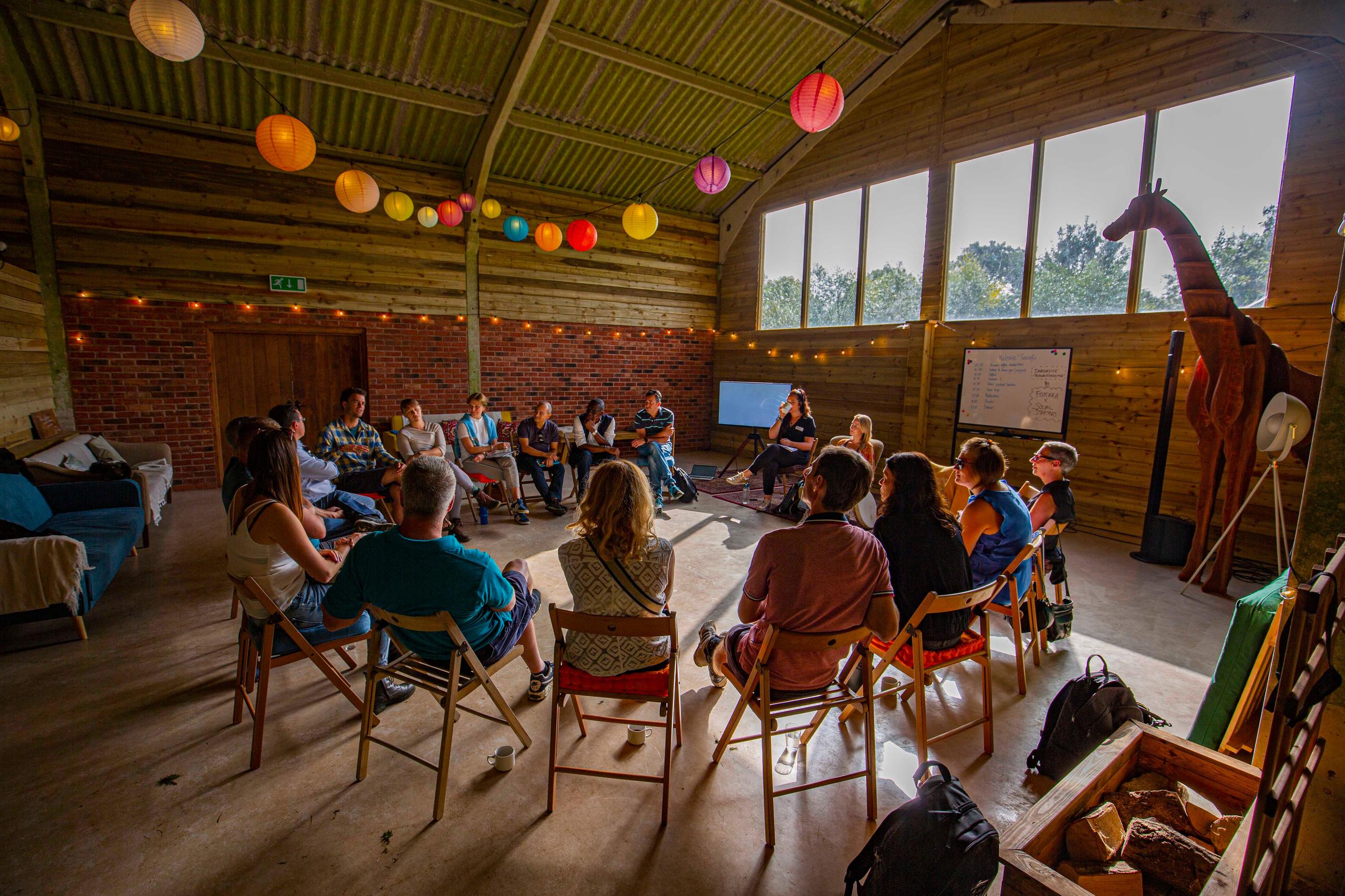 Interior of the large barn space used as a game room and social space