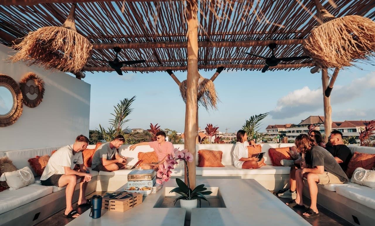 Rooftop lounge with panoramic views, soft seating, and relaxed atmosphere