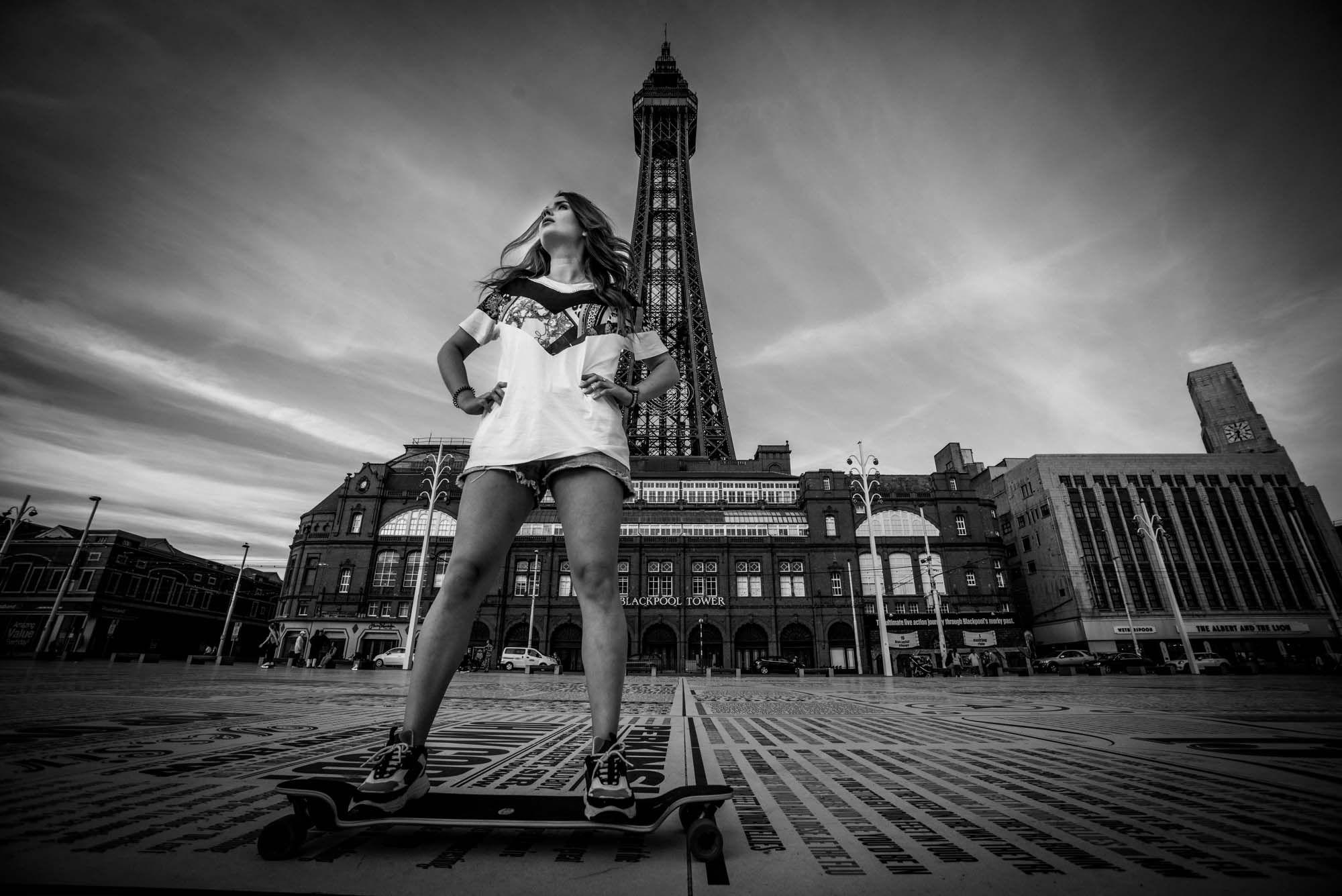 Person longboarding in front of Blackpool Tower