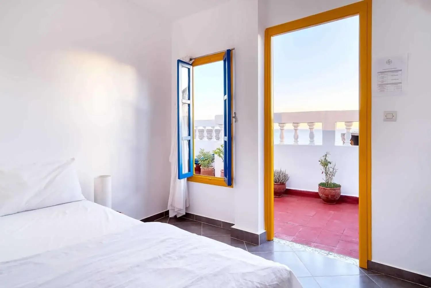 Example private bedroom at SunDesk with rooftop sea view