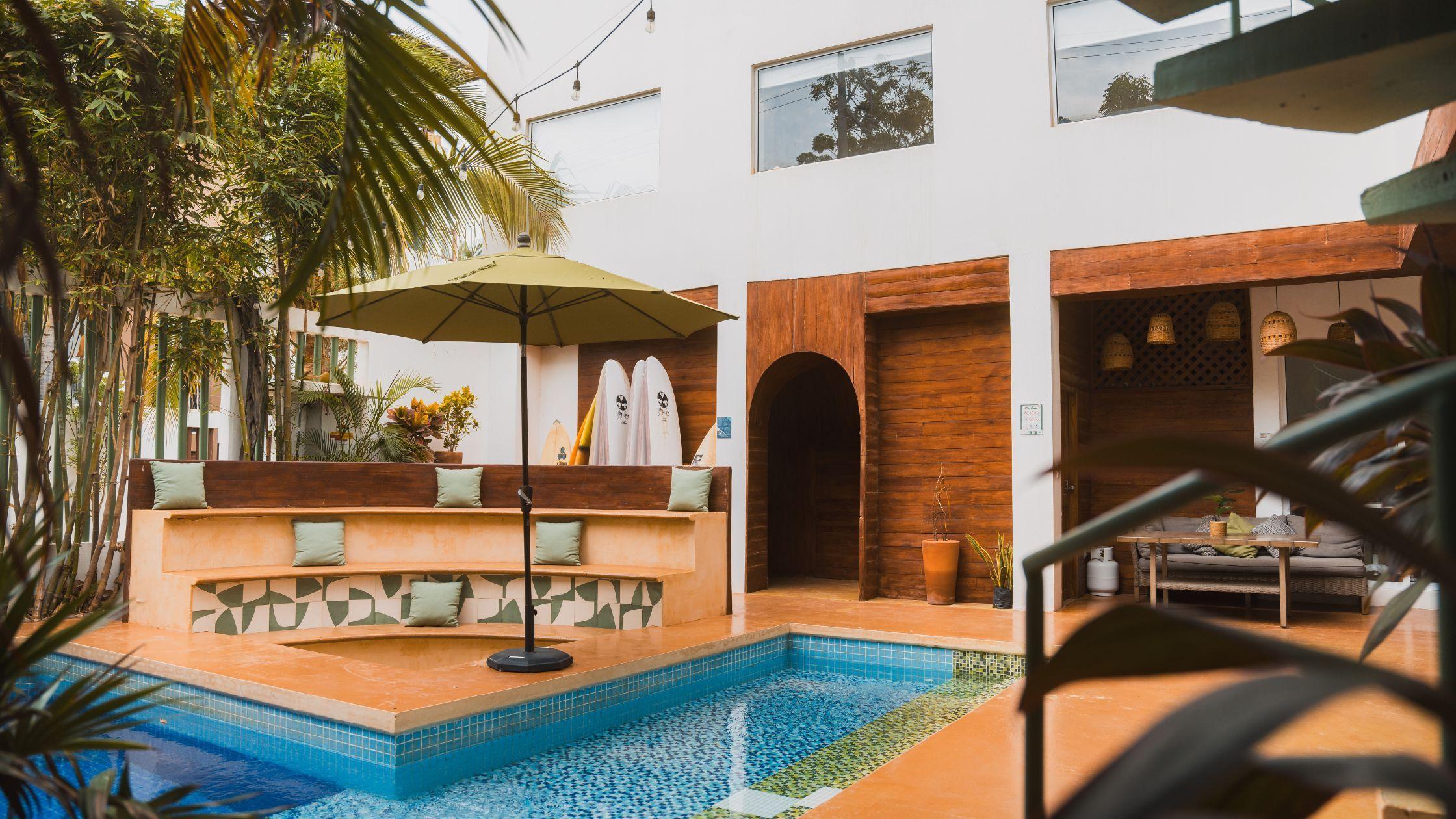 Surfbreak PXM's courtyard with pool and seating area
