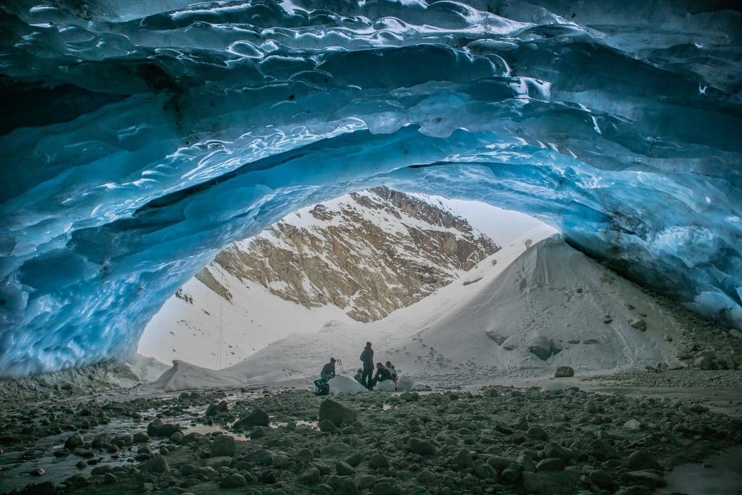 Inside the Zinal glacier with icy streams and caves