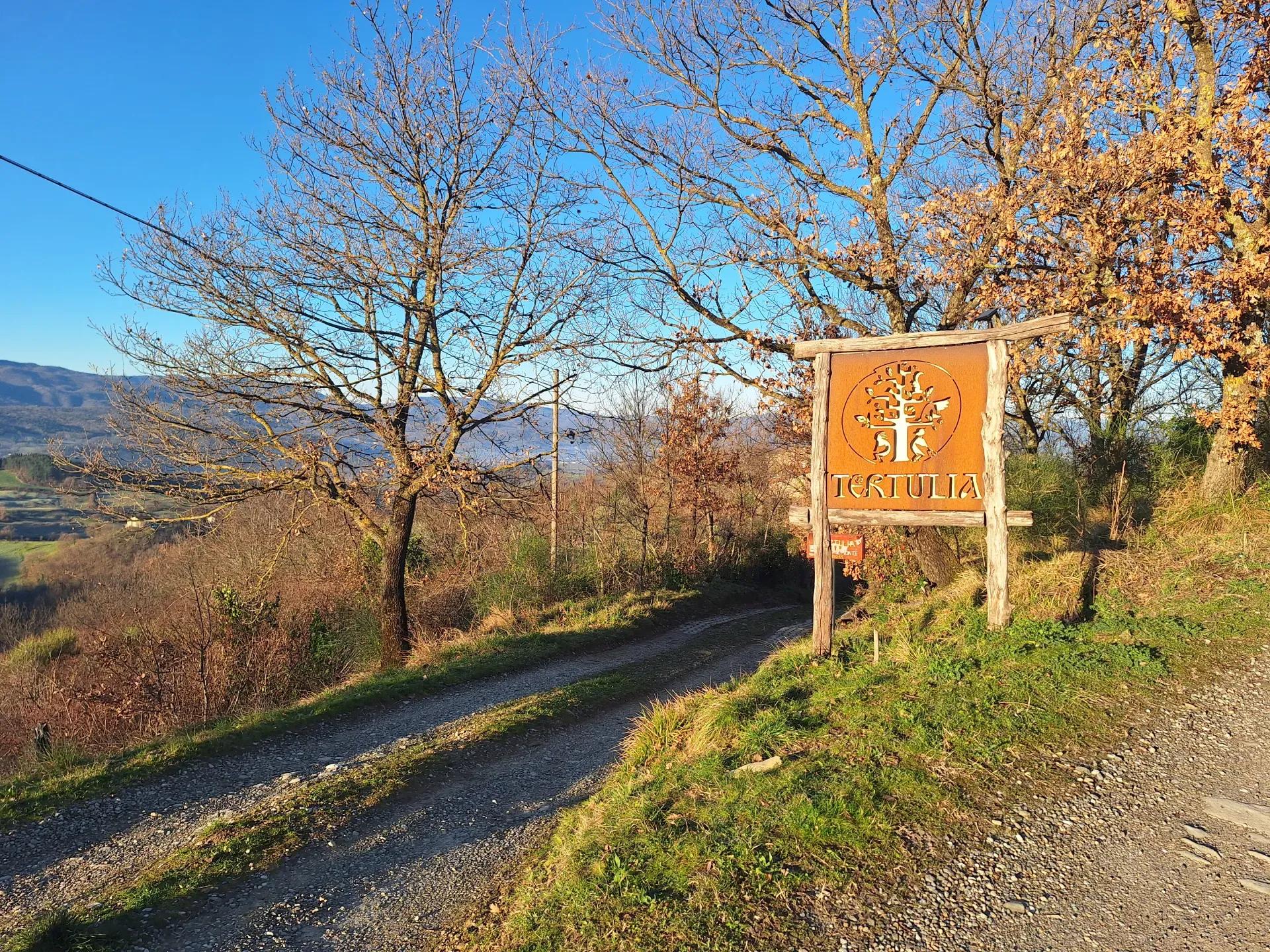 Tertulia panel at the entrance of the coliving and coworking in Tuscany