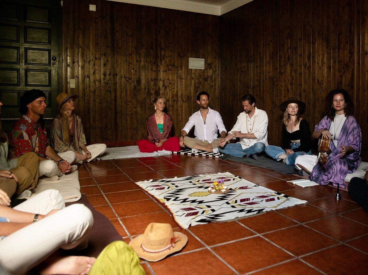 Community sharing circle with residents seated on the floor in a circle