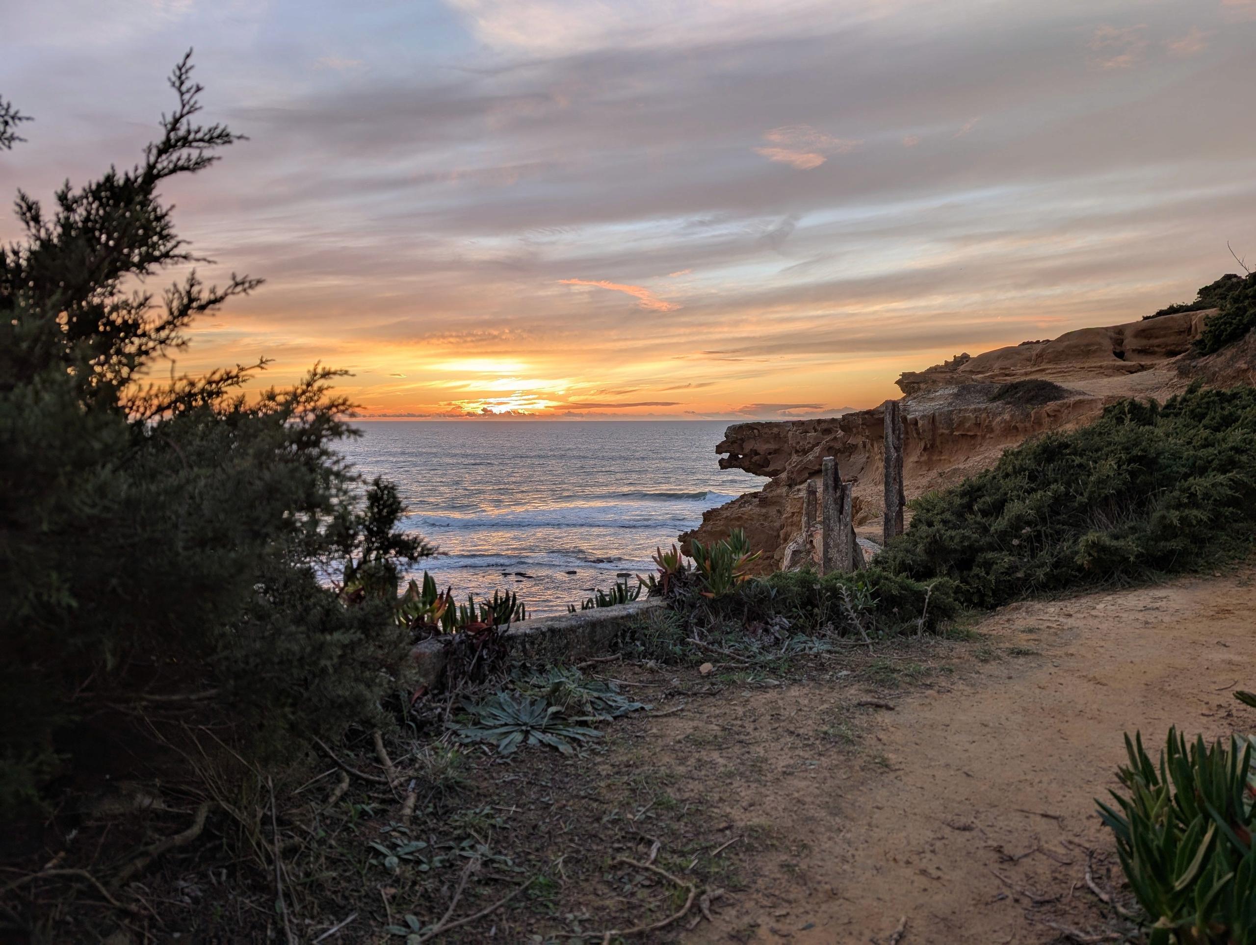 View of the beach from a cliffside in Ericeira, Portugal