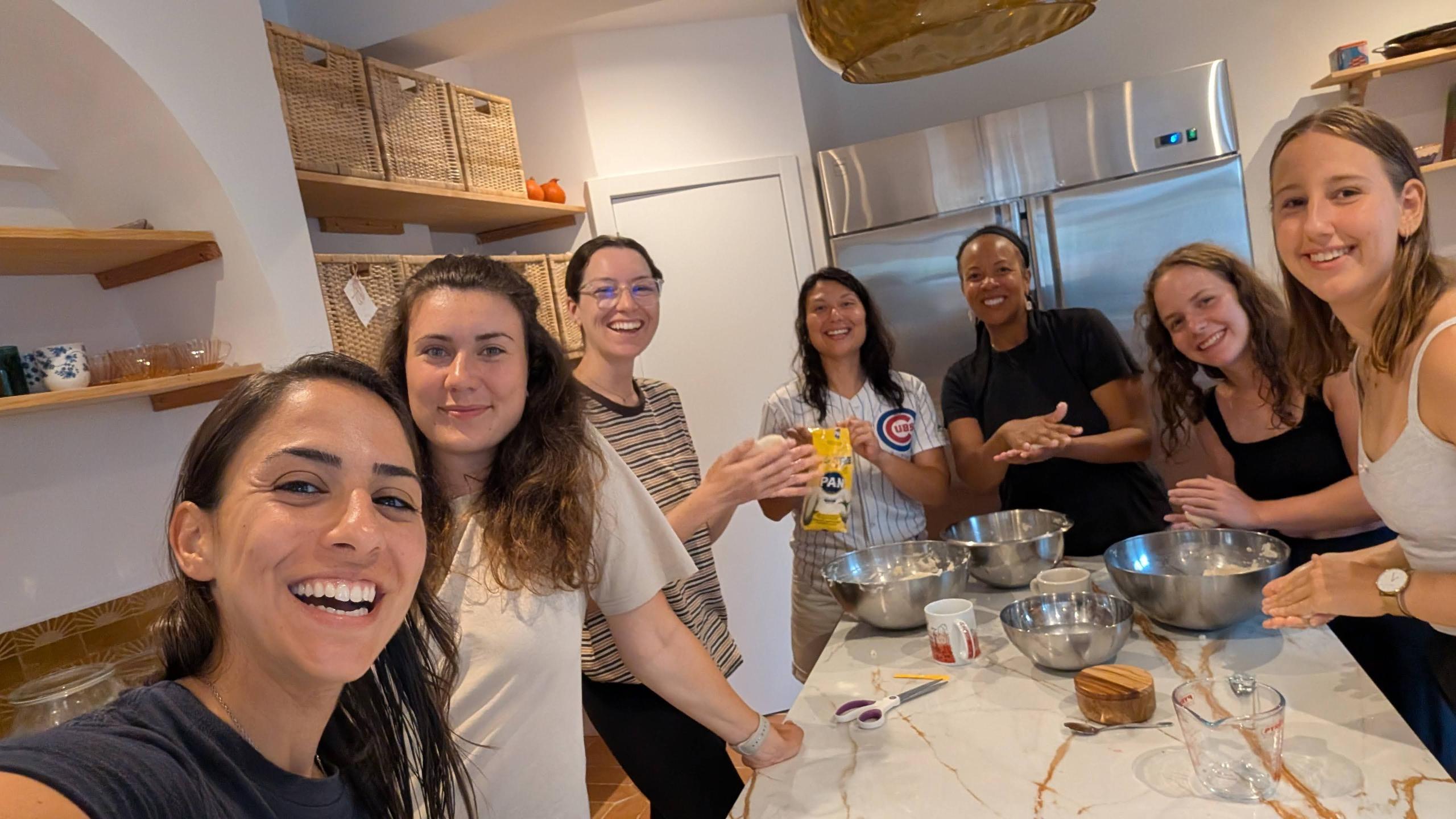 Group of residents cooking together in the Wild Souls kitchen