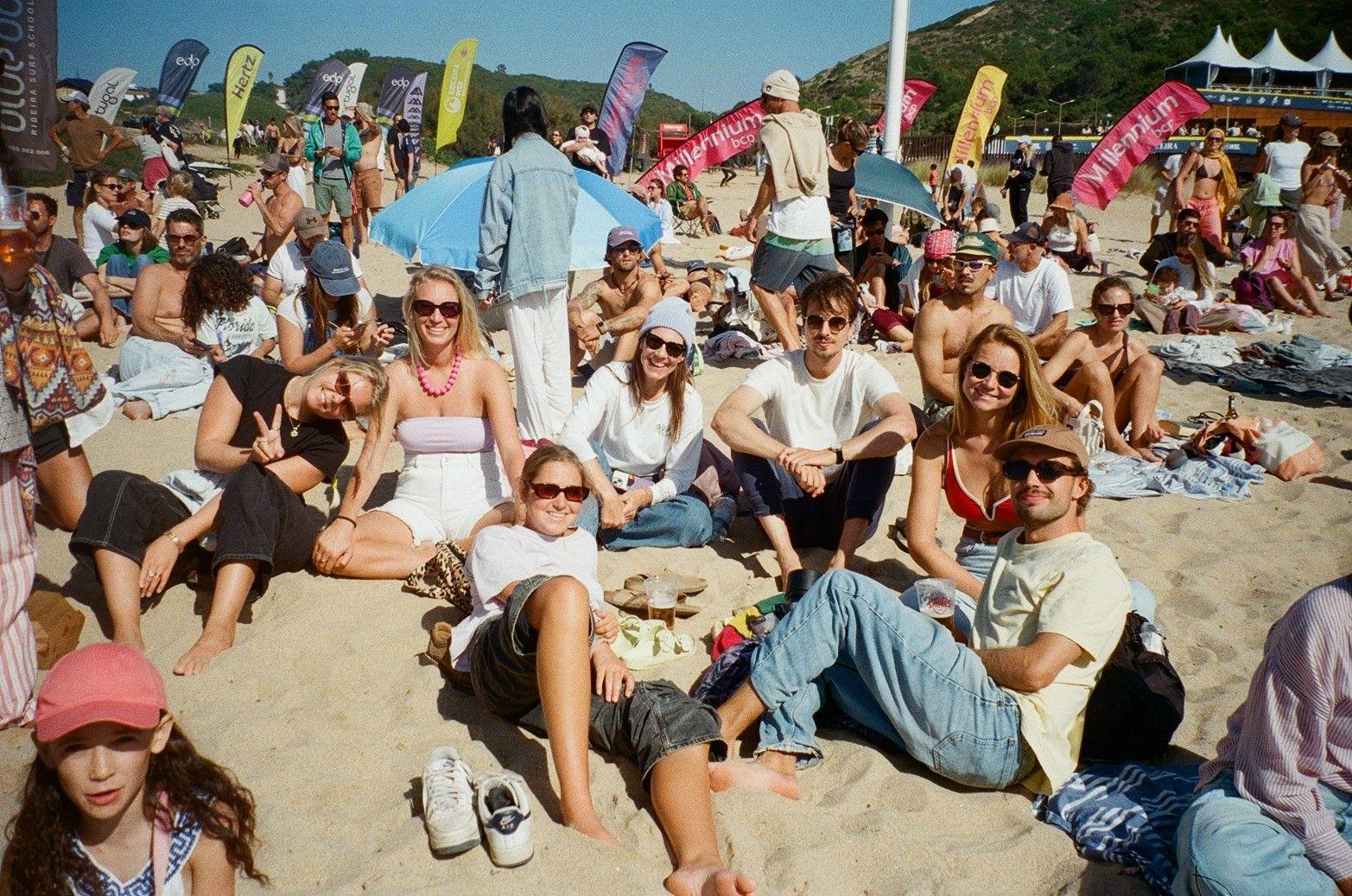 Group of Wild Souls residents relaxing together at a beach festival