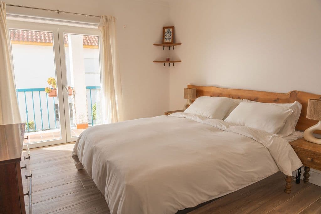 A comfortable room with a balcony for digital nomads and remote workers at Wild Souls Coliving