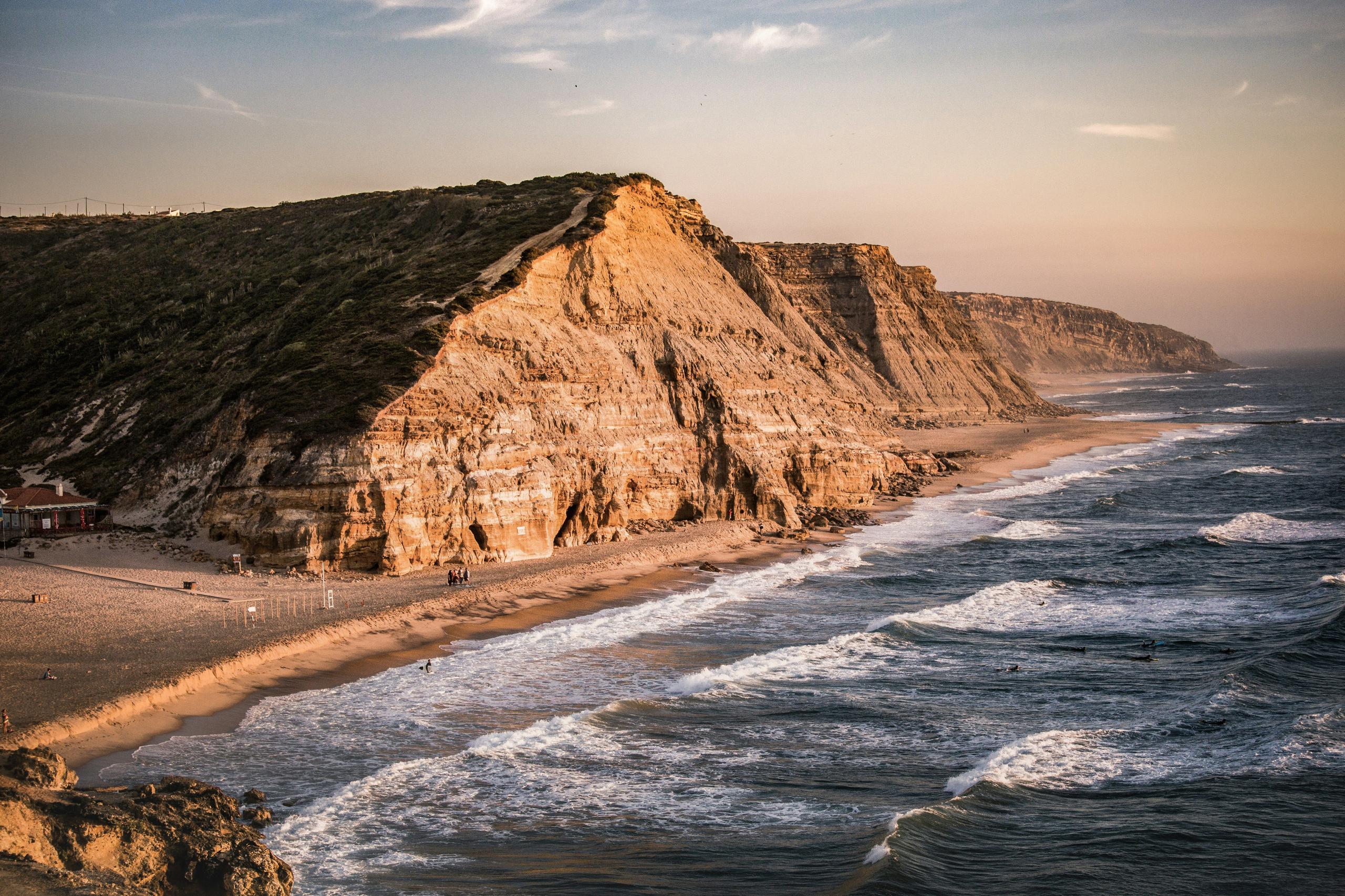 Aerial view of cliffs at beach near Ericeira Wild Souls housing for digital nomads Portugal